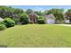 Charming single-Gathering home with a well-maintained lawn and a blend of brick and siding exterior at 422 Old Ivy Path, Mcdonough, GA 30253