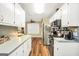 Kitchen features new stainless steel appliances and wood floors at 422 Old Ivy Path, Mcdonough, GA 30253