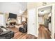 Bright and airy living room with fireplace flowing into kitchen for easy entertaining at 422 Old Ivy Path, Mcdonough, GA 30253