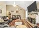 Comfortable living room featuring a fireplace and wood floors at 422 Old Ivy Path, Mcdonough, GA 30253