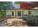 Spacious deck area ideal for entertaining with outdoor seating and house exterior with bay window at 230 Vienna Way, Douglasville, GA 30134