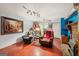Cozy finished basement features a stone fireplace, red painted flooring, and a comfortable seating area at 230 Vienna Way, Douglasville, GA 30134