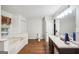 Bathroom featuring a soaking tub, vanity with sink, toilet and white shiplap walls at 230 Vienna Way, Douglasville, GA 30134