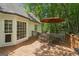 Outdoor deck with ample seating and a large umbrella, perfect for entertaining or relaxing at 230 Vienna Way, Douglasville, GA 30134