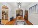 Open-concept dining room with wood floors, stylish lighting, and modern decor at 230 Vienna Way, Douglasville, GA 30134