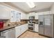 Updated kitchen with stainless steel appliances, granite counters, and breakfast bar at 230 Vienna Way, Douglasville, GA 30134
