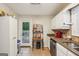 Bright kitchen with stainless steel appliances and a door to the backyard deck at 230 Vienna Way, Douglasville, GA 30134