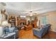 Charming living room features a brick fireplace, wooden floors, and comfortable seating arrangement at 230 Vienna Way, Douglasville, GA 30134