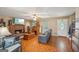 Inviting living room features a brick fireplace, wood floors, and ample seating, creating a cozy atmosphere at 230 Vienna Way, Douglasville, GA 30134