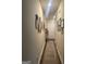 Inviting hallway with hardwood floors, decorated walls, and a clear path to the front door at 2635 Lovejoy Crossing Ln, Hampton, GA 30228