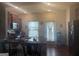 Well-lit kitchen with dark cabinetry, stainless steel microwave, and open view to the backyard at 2635 Lovejoy Crossing Ln, Hampton, GA 30228