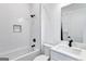 Modern bathroom with subway tile, soaking tub, and sleek fixtures at 3587 Candler Ct, Hapeville, GA 30354