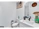 Bathroom featuring modern fixtures, a white vanity, decor, and a view into the glass enclosed shower at 3587 Candler Ct, Hapeville, GA 30354