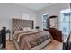 Well-lit bedroom with neutral colors, dresser, and large bed at 3587 Candler Ct, Hapeville, GA 30354