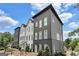 Modern three-story townhome with landscaped front yard at 3587 Candler Ct, Hapeville, GA 30354
