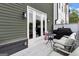 Cozy outdoor patio with seating and a grill, perfect for entertaining at 3587 Candler Ct, Hapeville, GA 30354