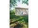 View of backyard of home from the side with lawn and trees at 1010 Forest Overlook Sw Dr, Atlanta, GA 30331