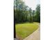 Large backyard with well-maintained green grass, perfect for outdoor activities at 1010 Forest Overlook Sw Dr, Atlanta, GA 30331