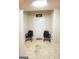 Basement area outside the movie theatre entry with 2 chairs at 1010 Forest Overlook Sw Dr, Atlanta, GA 30331