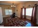 Spacious bedroom featuring hardwood floors, natural light and a comfortable reading chair at 1010 Forest Overlook Sw Dr, Atlanta, GA 30331