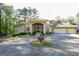 Stunning home featuring a circular driveway, fountain, and well-manicured landscaping at 1010 Forest Overlook Sw Dr, Atlanta, GA 30331