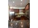 Gourmet kitchen featuring stainless steel appliances, dark wood cabinetry, and a center island at 1010 Forest Overlook Sw Dr, Atlanta, GA 30331