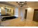 Main bathroom featuring jetted tub and glass shower, marble floors and vanity at 1010 Forest Overlook Sw Dr, Atlanta, GA 30331