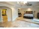 Main bedroom with sitting area and raised platform overlooking ensuite bathroom at 1010 Forest Overlook Sw Dr, Atlanta, GA 30331