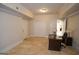 Basement office with arched entryway and travertine tile flooring at 1010 Forest Overlook Sw Dr, Atlanta, GA 30331