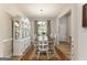 Bright and airy dining room featuring a classic china cabinet and a stylish chandelier, perfect for entertaining at 344 Dylan Way, Mcdonough, GA 30252