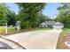 Long driveway leading to a charming home surrounded by lush greenery offering privacy and a sense of tranquility at 344 Dylan Way, Mcdonough, GA 30252