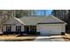 Charming single-story home with gray siding, black shutters, and a well-manicured front yard at 344 Dylan Way, Mcdonough, GA 30252