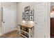 Inviting foyer featuring a console table with decorative lamps and a gallery wall of Gathering photos at 344 Dylan Way, Mcdonough, GA 30252