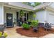 Cozy front porch with rocking chairs, hanging ferns, and charming decor, creating a welcoming entrance at 344 Dylan Way, Mcdonough, GA 30252