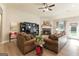 Cozy living room with comfortable seating, a stone fireplace, and ample natural light, creating a welcoming atmosphere at 344 Dylan Way, Mcdonough, GA 30252