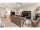 Open living room featuring a stone fireplace and built-in entertainment center at 344 Dylan Way, Mcdonough, GA 30252