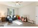 Well-lit playroom with large window and comfortable seating at 344 Dylan Way, Mcdonough, GA 30252