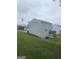 View of the backyard, with green grass and an elevated deck at 7253 Lacey Dr, Douglasville, GA 30134