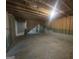 Unfinished basement featuring exposed beams and foundation, offering potential for customization at 7253 Lacey Dr, Douglasville, GA 30134