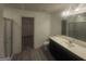 Bathroom with double vanity and shower stall with sliding glass door at 7253 Lacey Dr, Douglasville, GA 30134