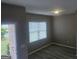 Well-lit bedroom with vinyl floors and a window showcasing the outdoors at 7253 Lacey Dr, Douglasville, GA 30134