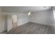 Bedroom with gray plank flooring, ceiling fan, and a doorway to another room at 7253 Lacey Dr, Douglasville, GA 30134