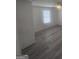 Bedroom featuring hard surface flooring, a large window, and a ceiling fan at 7253 Lacey Dr, Douglasville, GA 30134