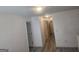 Hallway with light colored walls and doors and hard surface flooring at 7253 Lacey Dr, Douglasville, GA 30134