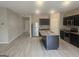 Kitchen with stainless steel appliances, dark wood cabinets, and a center island at 7253 Lacey Dr, Douglasville, GA 30134