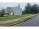 Exterior shot of the side of the home, showing the lawn and street at 7253 Lacey Dr, Douglasville, GA 30134