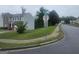 View down a residential street in the community showcasing well-manicured lawns and sidewalks at 7253 Lacey Dr, Douglasville, GA 30134