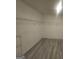 Walk-in closet with gray plank flooring and wire shelving at 7253 Lacey Dr, Douglasville, GA 30134
