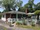 Cozy backyard deck featuring a brick house with a grill and seating area at 520 Mcdonough Rd, Hampton, GA 30228