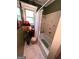 Bathroom with bathtub, shower curtain, tile accents, and decorative shelving at 520 Mcdonough Rd, Hampton, GA 30228